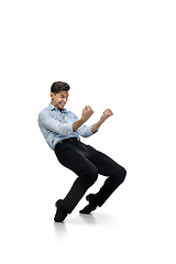 Image showing Happy young man dancing in casual clothes or suit, remaking legendary moves of celebrity from culture history