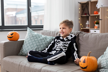 Image showing happy boy in halloween costume of skeleton at home