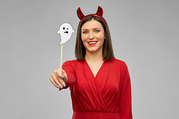Image showing happy woman in red halloween costume of devil