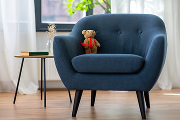 Image showing modern armchair with teddy bear toy at home