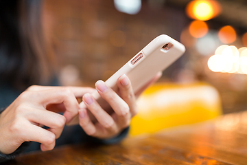 Image showing Woman working on cellphone