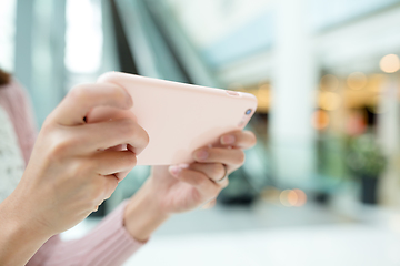 Image showing Woman sending sms on smart phone