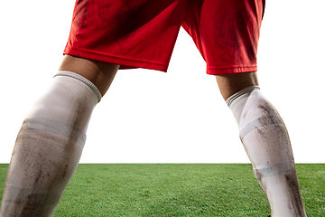 Image showing Close up legs of professional soccer, football player fighting for ball on field isolated on white background