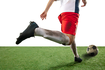 Image showing Close up legs of professional soccer, football player fighting for ball on field isolated on white background