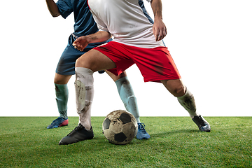 Image showing Close up legs of professional soccer, football players fighting for ball on field isolated on white background