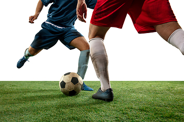 Image showing Close up legs of professional soccer, football players fighting for ball on field isolated on white background