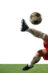 Image showing Close up legs of professional soccer, football player fighting for ball on field isolated on white background