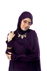 Image showing Beautiful arab woman posing in stylish hijab isolated on studio background. Fashion concept