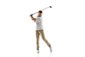 Image showing Golf player in a white shirt taking a swing isolated on white studio background