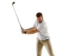 Image showing Golf player in a white shirt taking a swing isolated on white studio background