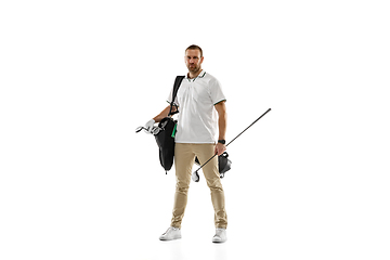 Image showing Golf player in a white shirt practicing, playing isolated on white studio background