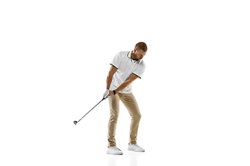 Image showing Golf player in a white shirt practicing, playing isolated on white studio background