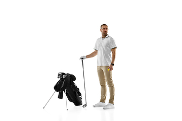 Image showing Golf player in a white shirt practicing, playing isolated on white studio background