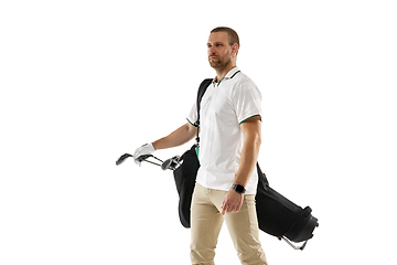 Image showing Golf player in a white shirt practicing, playing isolated on white studio background