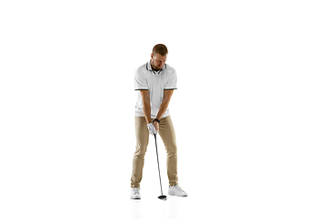 Image showing Golf player in a white shirt practicing, playing isolated on white studio background