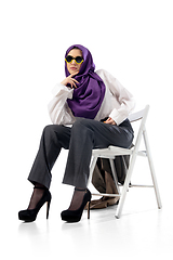 Image showing Beautiful arab woman posing in stylish office attire isolated on studio background. Fashion concept