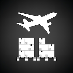 Image showing Boxes on pallet under airplane