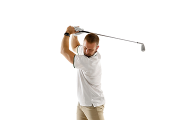 Image showing Golf player in a white shirt taking a swing isolated on white studio background