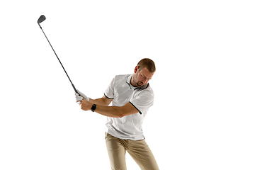 Image showing Golf player in a white shirt taking a swing isolated on white studio background