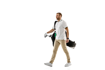 Image showing Golf player in a white shirt practicing, playing isolated on white studio background