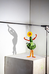 Image showing Flying food composition making beautiful ballerina drawing shadow on the wall