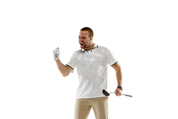 Image showing Golf player in a white shirt practicing, playing isolated on white studio background