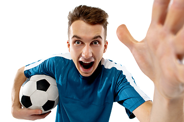 Image showing Funny emotions of professional soccer player isolated on white studio background, excitement in game