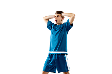 Image showing Funny emotions of professional soccer player isolated on white studio background, excitement in game