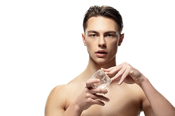 Image showing Portrait of young man isolated on white studio background. Caucasian attractive male model. Concept of fashion and beauty, self-care, body and skin care.