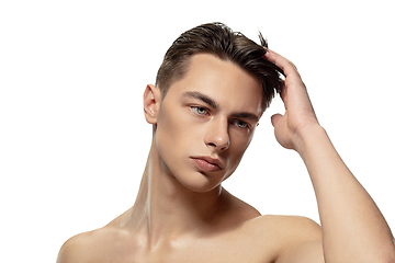 Image showing Portrait of young man isolated on white studio background. Caucasian attractive male model. Concept of fashion and beauty, self-care, body and skin care.