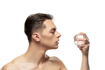 Image showing Portrait of young man isolated on white studio background. Caucasian attractive male model. Concept of fashion and beauty, self-care, body and skin care.