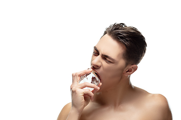 Image showing Portrait of young man isolated on white studio background. Caucasian attractive male model. Concept of fashion and beauty, self-care, body and skin care.