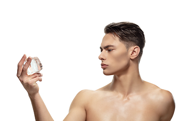 Image showing Portrait of young man isolated on white studio background. Caucasian attractive male model. Concept of fashion and beauty, self-care, body and skin care.