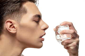 Image showing Portrait of young man isolated on white studio background. Caucasian attractive male model. Concept of fashion and beauty, self-care, body and skin care.