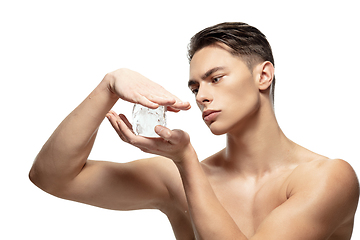 Image showing Portrait of young man isolated on white studio background. Caucasian attractive male model. Concept of fashion and beauty, self-care, body and skin care.