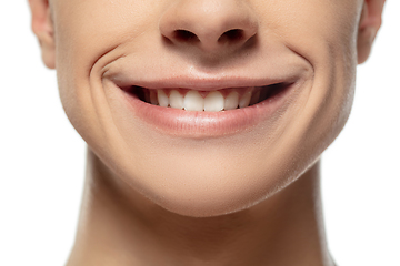 Image showing Close up face of young man isolated on white studio background. Caucasian attractive male model. Concept of fashion and beauty, self-care, body and skin care.