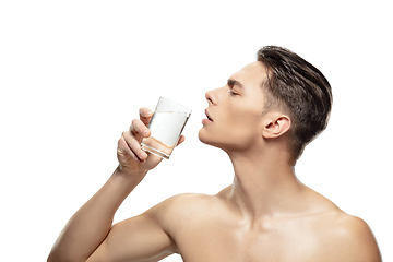 Image showing Portrait of young man isolated on white studio background. Caucasian attractive male model. Concept of fashion and beauty, self-care, body and skin care.