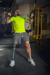 Image showing Disabled man training in the gym of rehabilitation center