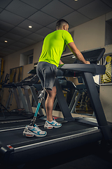 Image showing Disabled man training in the gym of rehabilitation center