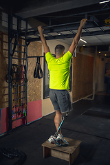 Image showing Disabled man training in the gym of rehabilitation center