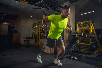 Image showing Disabled man training in the gym of rehabilitation center