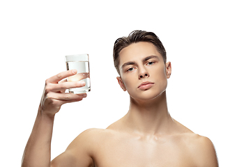 Image showing Portrait of young man isolated on white studio background. Caucasian attractive male model. Concept of fashion and beauty, self-care, body and skin care.