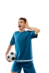 Image showing Funny emotions of professional soccer player isolated on white studio background, excitement in game