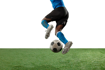 Image showing Close up legs of professional soccer, football player fighting for ball on field isolated on white background