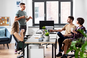 Image showing team of startuppers drinking coffee at office