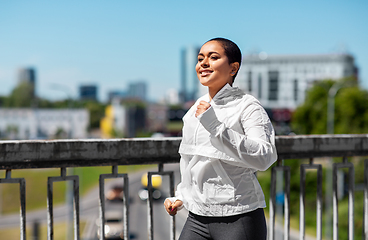 Image showing african american woman running outdoors