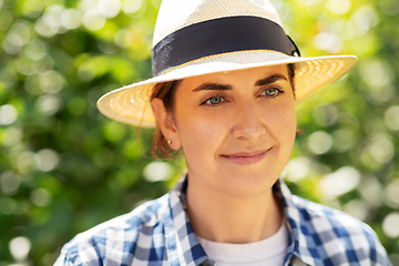 Image showing portrait of woman in straw hat at summer garden
