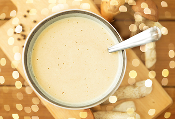 Image showing mushroom cream soup in bowl on cutting board