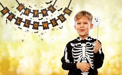 Image showing boy in halloween costume with ghost decoration