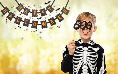 Image showing boy in halloween costume of skeleton making faces